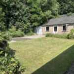 Achtertuin en garage